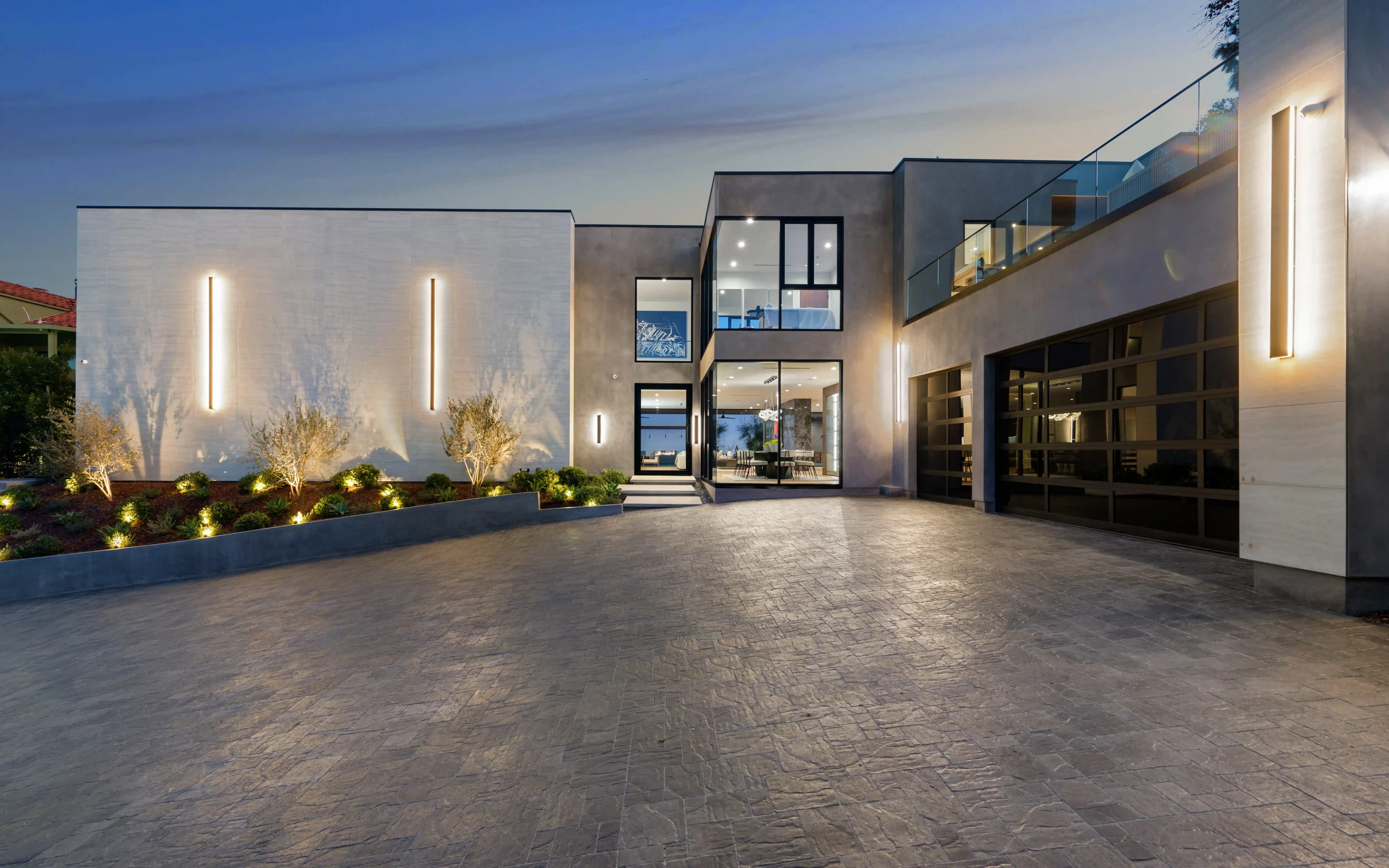 Suburban two-storey home with pink sunset sky